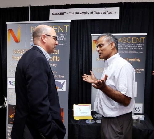 Dr. Sreenivasan in front of the NASCENT booth at NEXTFLEX Innovation Day 2018