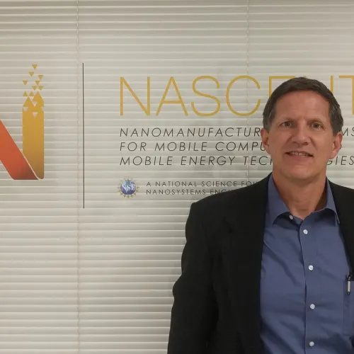 Matt Weldon standing in front of window glass outside NASCENT office
