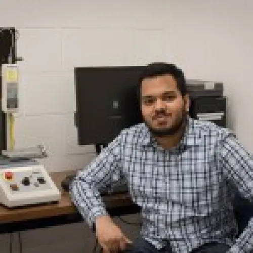 Vasish Mohan seated at desk